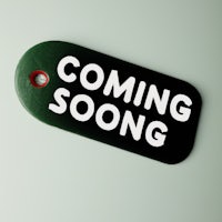 a tag with the word coming soon on it